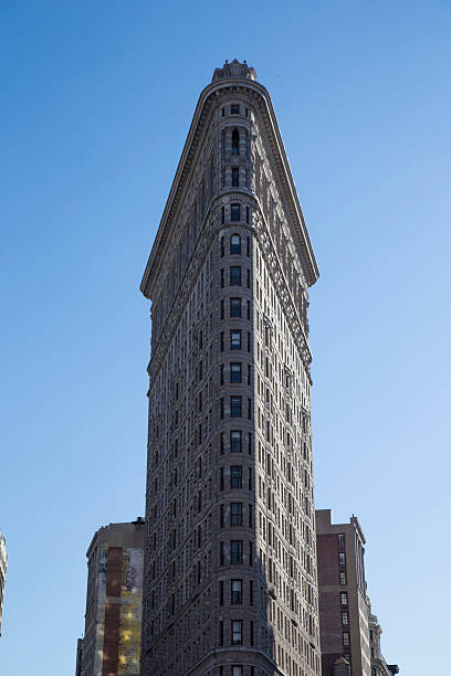 istock Flat Iron building facade in new york 613102078