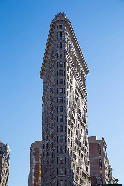 istock Flat Iron building facade in new york 613102108
