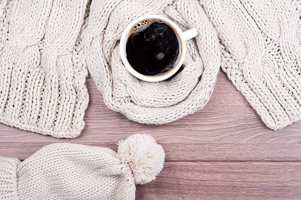 istock Coffee cup, handmade knitted wool scarf and cap. Winter clothes 613102744