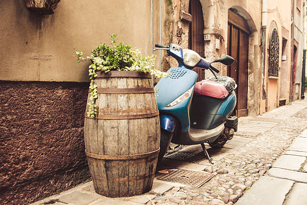 typical street scene with old scooter in Italy typical street scene anywhere in Italy marche italy photos stock pictures, royalty-free photos & images
