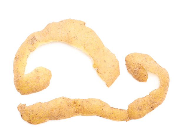 istock Two potato peel pieces isolated 613106672