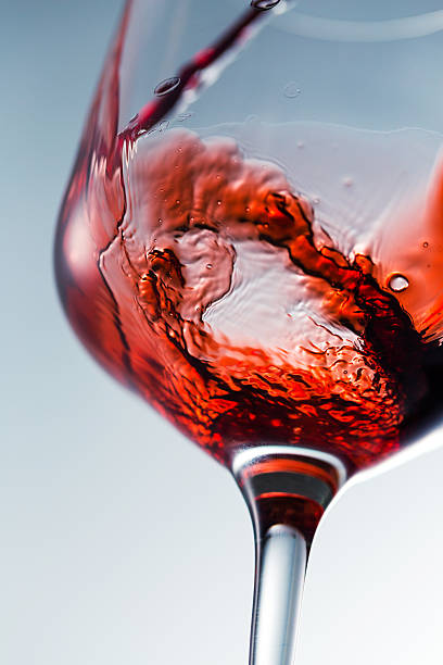 istock Red wine pouring in glass 613112712