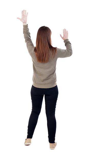 istock back view of dancing young beautiful  woman. 613112896