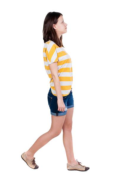 istock back view of walking  woman. 613112936
