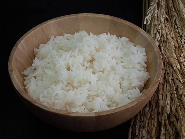 istock bowl full of rice on white 613114794