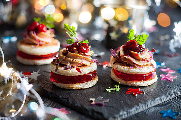 Foie gras and cranberry chutney Festive appetizer with foie gras, cranberry chutney and jelly canape stock pictures, royalty-free photos & images