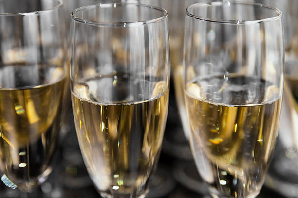 istock glasses of champagne on dark background 613116074