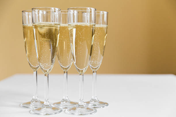 istock glasses of champagne on bright background 613116322