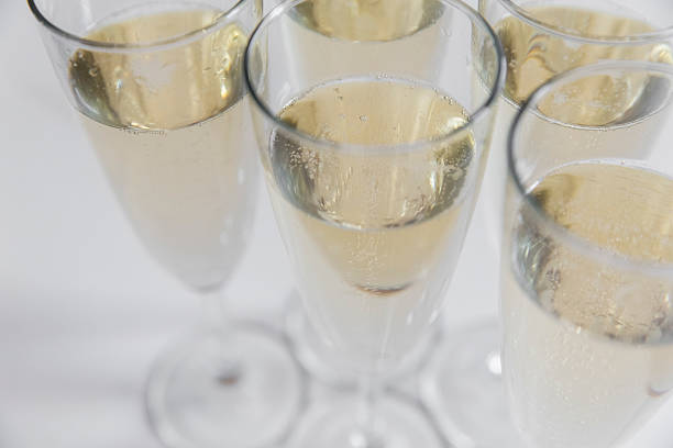 istock glasses of champagne on bright background 613116444