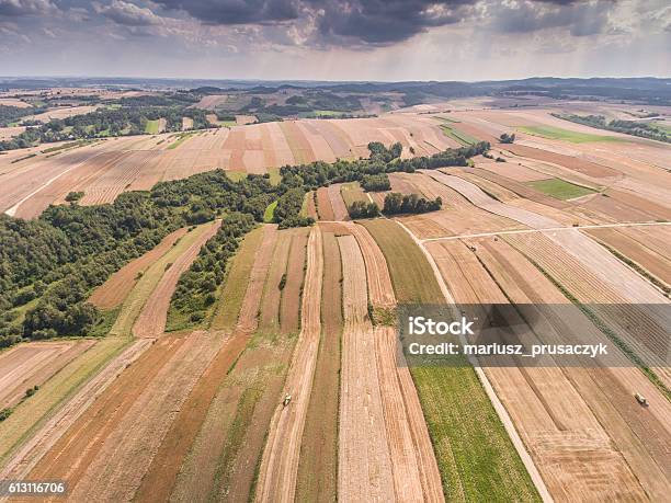 Aerial View Of The Blue Sky And Village Harvest Fields Stock Photo - Download Image Now