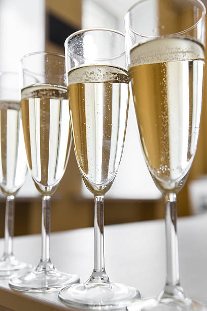 istock glasses of champagne on bright background 613116874