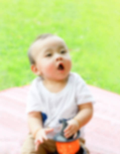asiática boneco de garoto segurar abóbora - doll evil child baby - fotografias e filmes do acervo