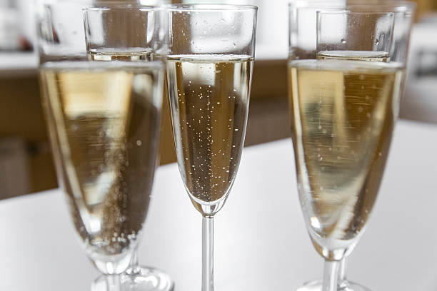 istock glasses of champagne on bright background 613116928