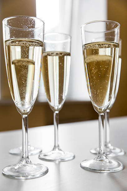 istock glasses of champagne on bright background 613117044
