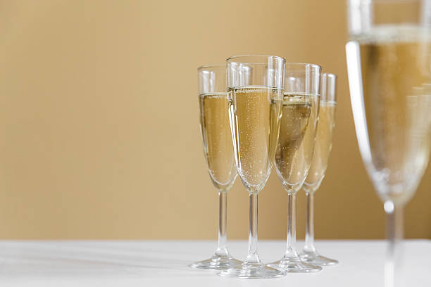 istock glasses of champagne on bright background 613117210
