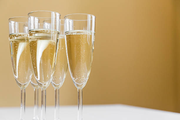 glasses of champagne on bright background stock photo