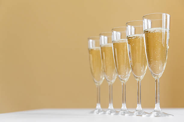 glasses of champagne on bright background stock photo