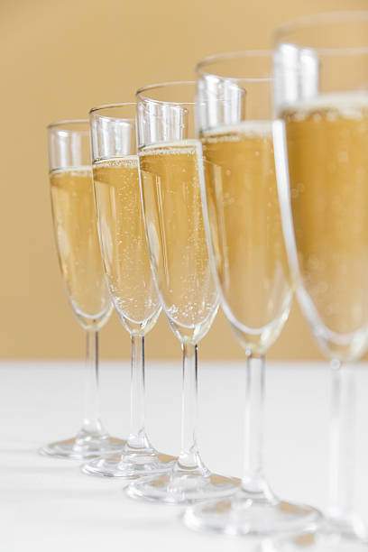 glasses of champagne on bright background stock photo