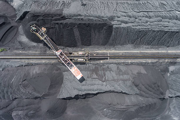 istock Mining excavator on the bottom surface mine. Brown coal deposits 613117808