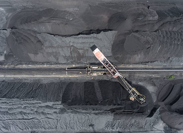 istock Mining excavator on the bottom surface mine. Brown coal deposits 613117960