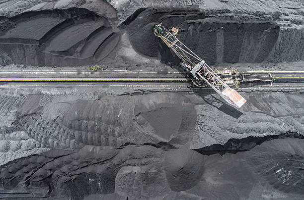 Mining excavator on the bottom surface mine. Brown coal deposits