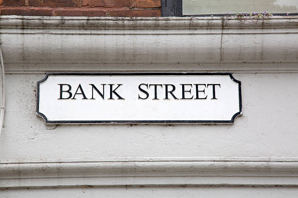istock Bank Street on White and Brick Wall 613118082
