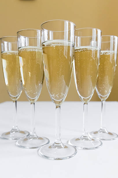 glasses of champagne on bright background stock photo