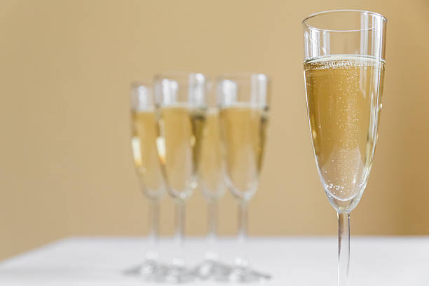 glasses of champagne on bright background stock photo