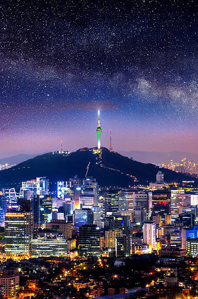 View of downtown cityscape and Seoul tower with Milky way. View of downtown cityscape and Seoul tower with Milky way in Seoul, South Korea. aerial view of seoul south korea capital city stock pictures, royalty-free photos & images