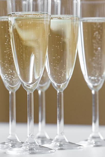 istock glasses of champagne on bright background 613118600
