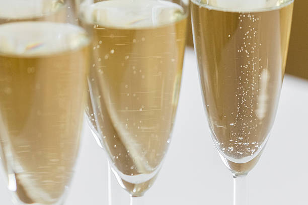 glasses of champagne on bright background stock photo