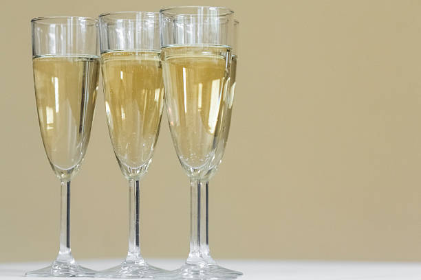 istock glasses of champagne on bright background 613119052