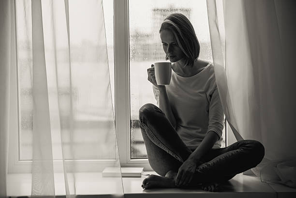 istock frustrated woman drinking coffee with copy space 613120170