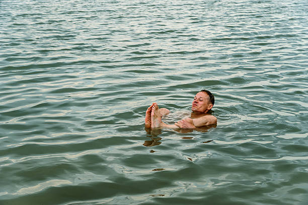 istock Man on the surface of the water. 613120314