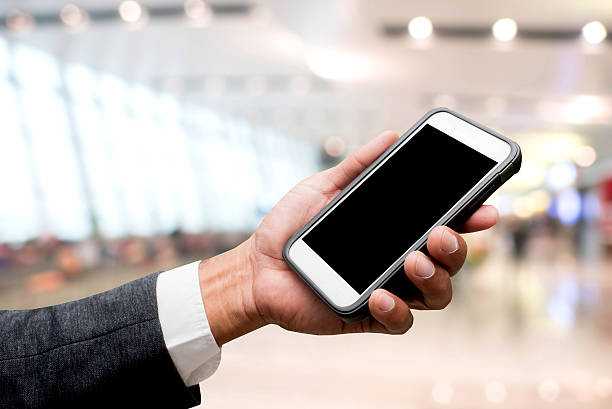 istock hand hold smart phone with blur background 613121382