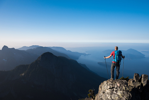 Hiker trekking over ocean views