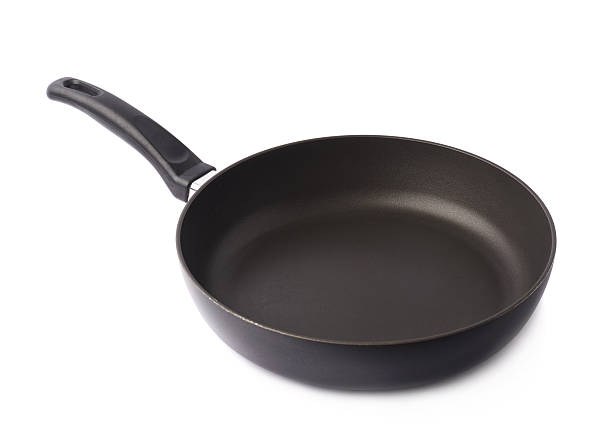 istock Black metal frying pan isolated 613122558