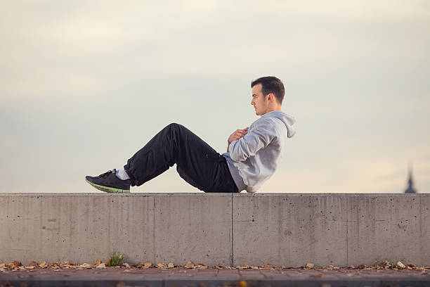 istock Young man exercising outdoors. 613123658