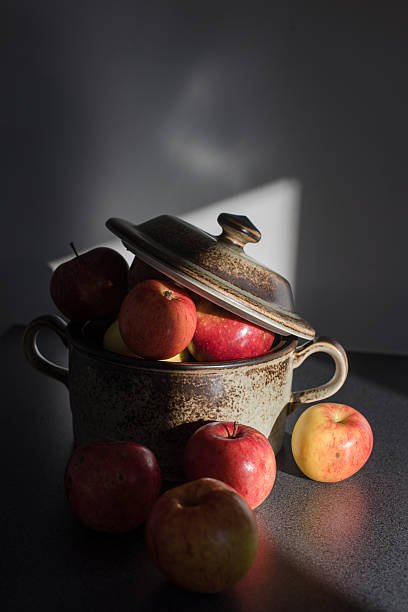 istock Fresh apples in pot of clay in shadow 613124050