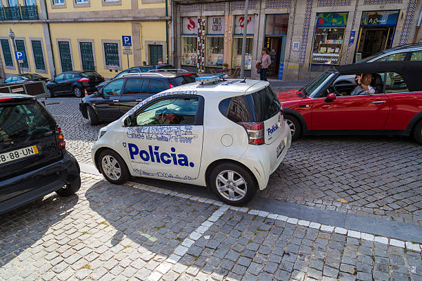 Portuguese police car on duty in Porto, Portugal Porto, Portugal - September 12, 2016: Small white police car on duty parked on street of Porto, Portugal psp stock pictures, royalty-free photos & images