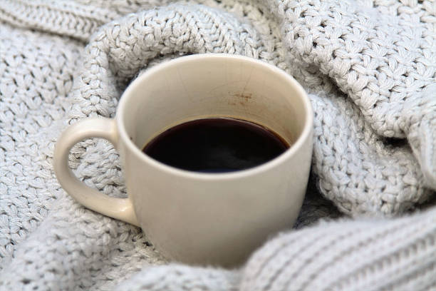 istock Coffee in think knit sweater 613124922