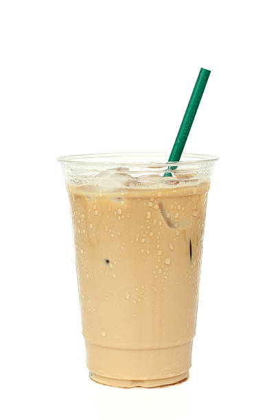 istock Iced coffee cafe latte in white background 613125336