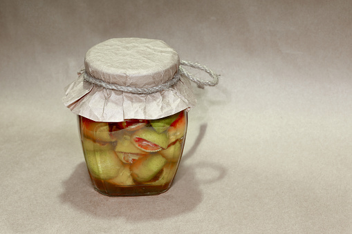 Lemon with rosy pulp (Citrus aurantifolia) and honey in glass jars