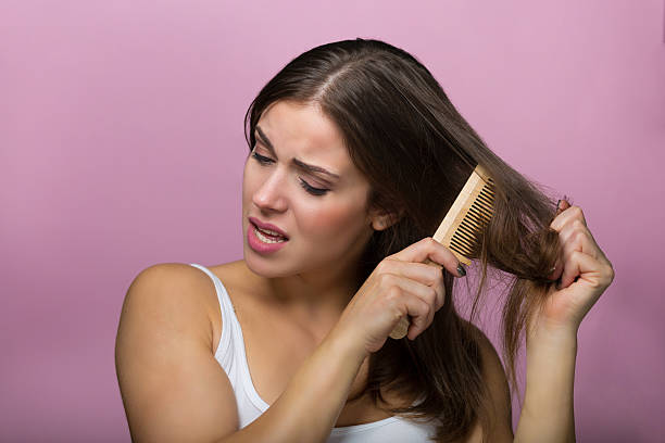 istock Woman brushing her hair 613130988