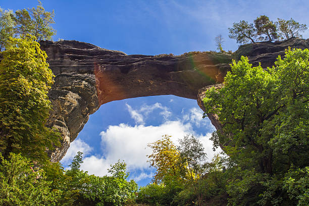 The Prebischtor and Hotel in Bohemian Switzerland Czech Republic The Prebischtor and Hotel in Bohemian Switzerland the largest natural sandstone rock bridge in Europe pravcicka stock pictures, royalty-free photos & images
