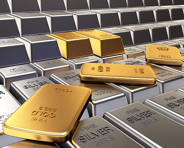 istock Rows of silver and golden ingots. 613131364