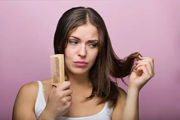 Photo of Woman brushing her hair