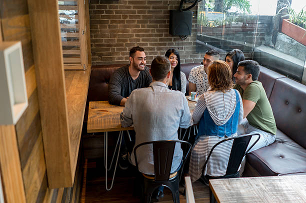 istock Happy friends eating at a restaurant 613131772