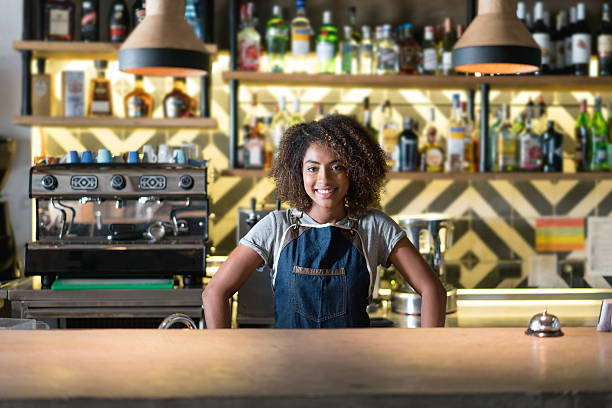 istock African American waitress serving at a restaurant 613131922