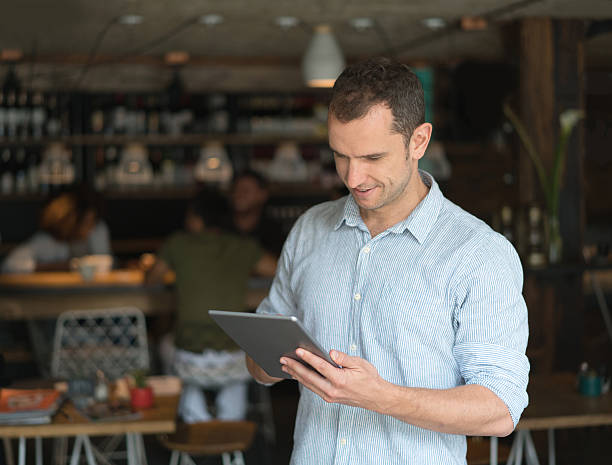 istock Business owner running a restaurant 613131926